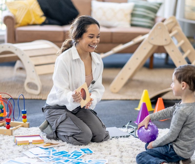 Parent reviewing information or preparing for first in-home autism therapy session