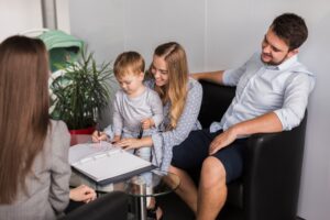 Child signing document or contract in playful or educational context
