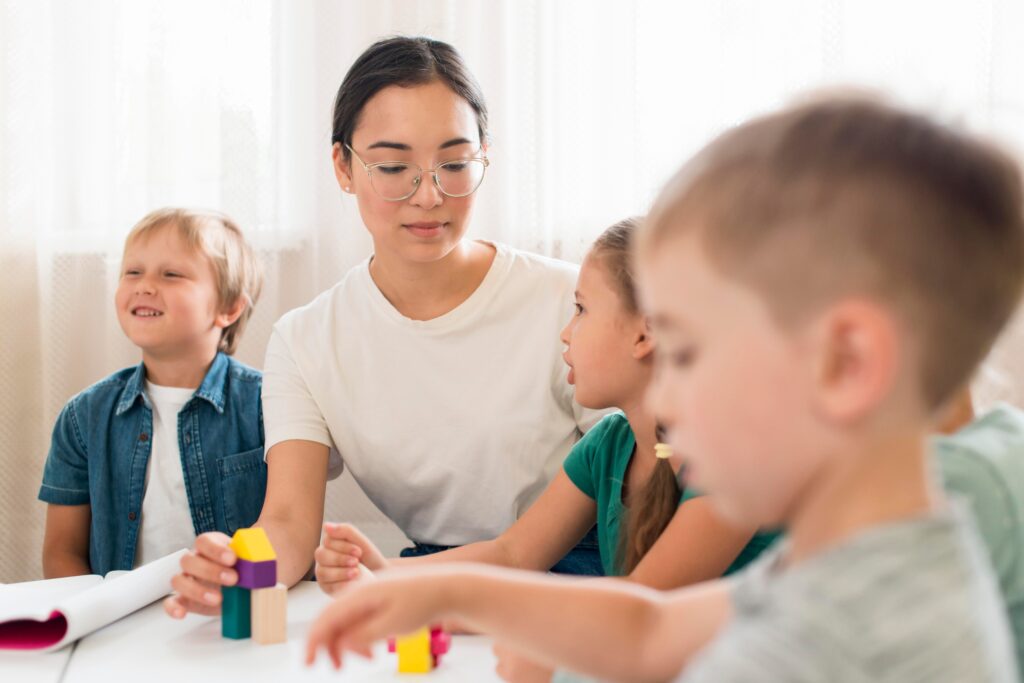 woman teaching kids how play with colorful game 1