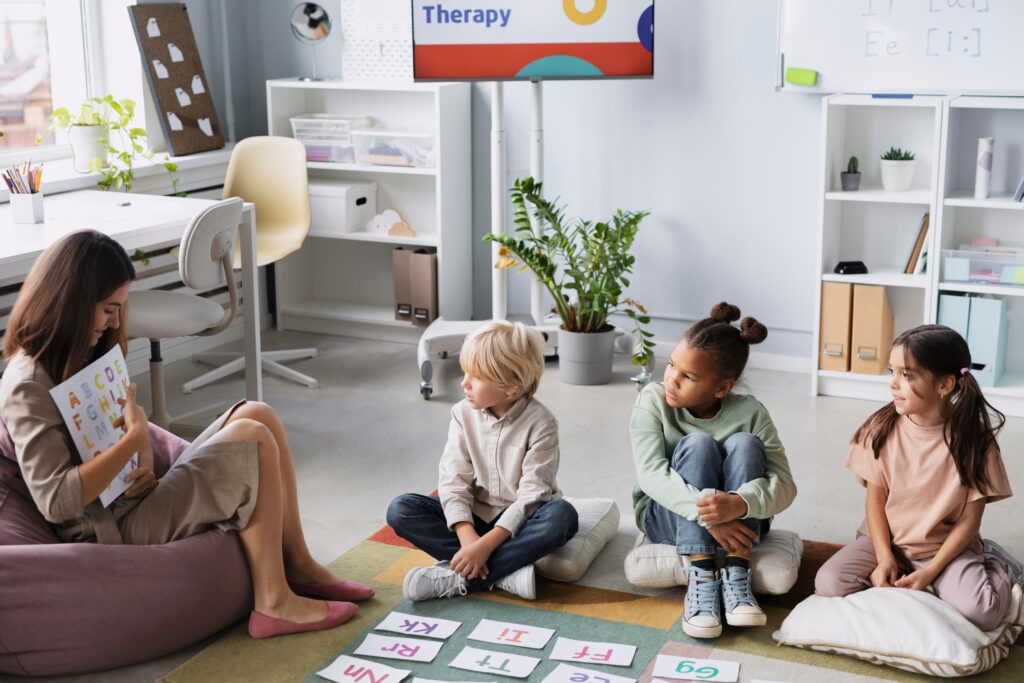 young woman doing speech therapy with kids 2 1